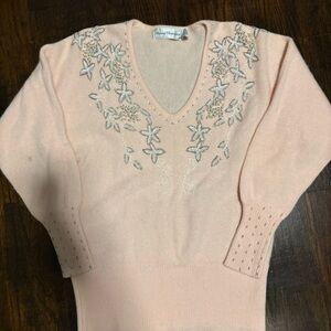 Vintage soft pink wool swea with silver and white beadwork.